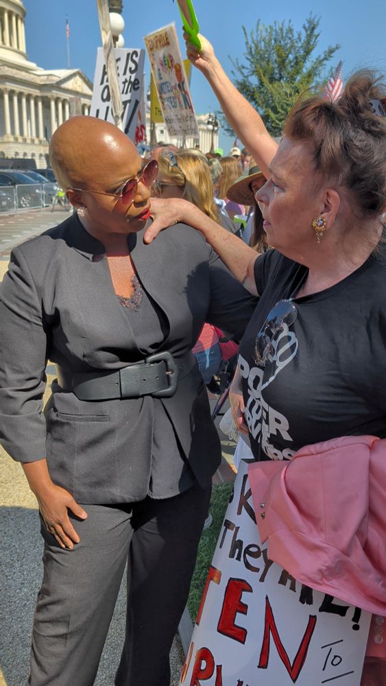 Rep Ayanna Pressley actively listens to a survivor who shares her story of sexual abuse