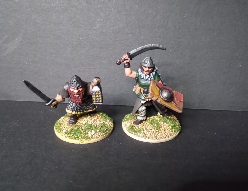 An Oarhmark dwarf with Frostgrave Fighter I arms and a Frostgrave Barbarian II with Oathmark goblin slave arms and Oarhmark human infantry shield.