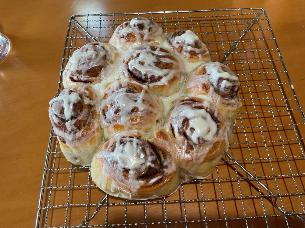 9 cinnamon scrolls waiting to cool down before delivering