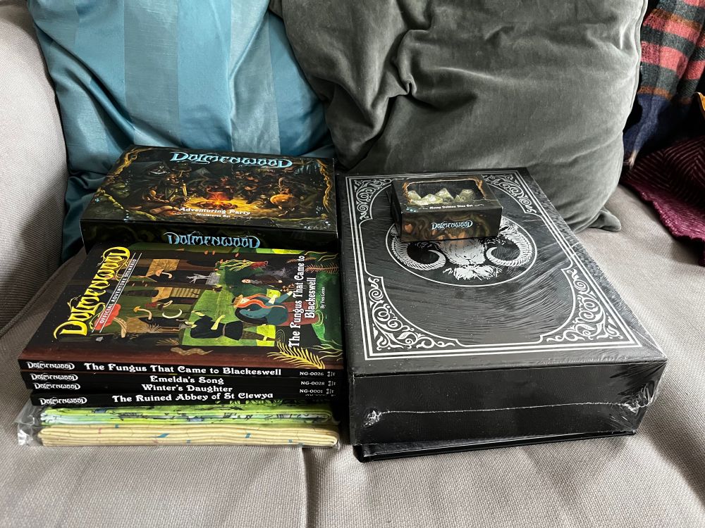 The Dolmenwood Limit Loot pledge in all it's glory, miraculously surviving it's I'll packaged journey. Fortunately the only damage was to the box containing the dice...