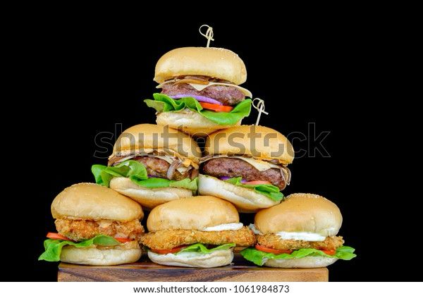 A stack of burgers and chicken sandwiches in the vague shape of a pyramid 

Complete with a shutterstock watermark