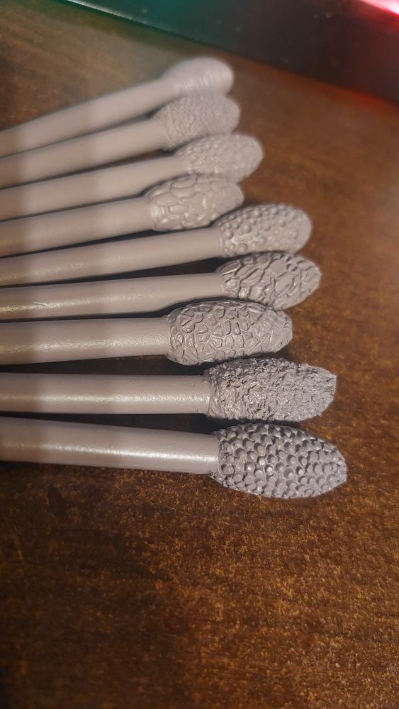 Eight textured clay tools designed to impress patterns on the material. They range from 'innocent treebark' kind of vibe to 'gaping holes in flesh from whence alien things will peek before retreating back into the darkness' anti-vibe. 