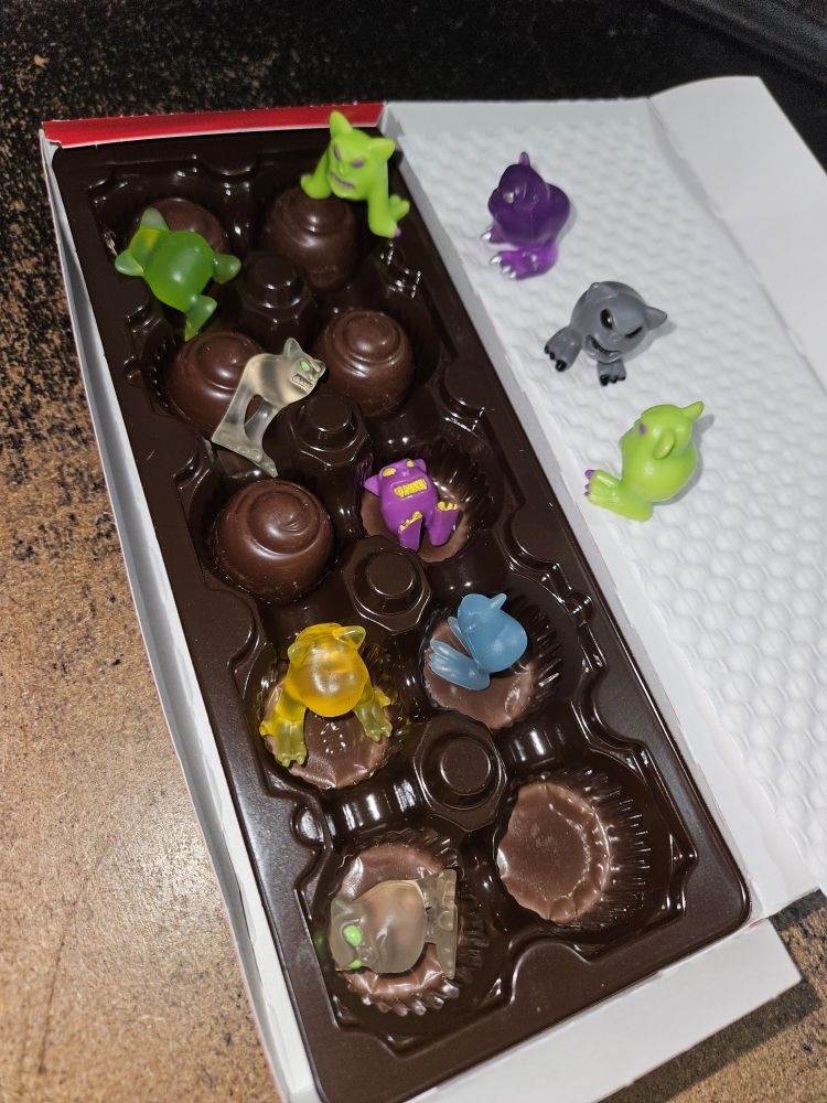 A box of cherry chocolates being feasted upon by Mordles
