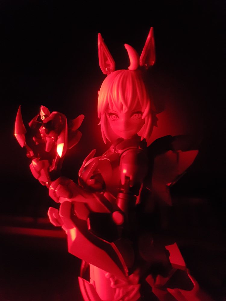 "Mad Wolf" Carolina Rolfe in her cyber wolf armor, just about to put her mask on.  Full red lighting.