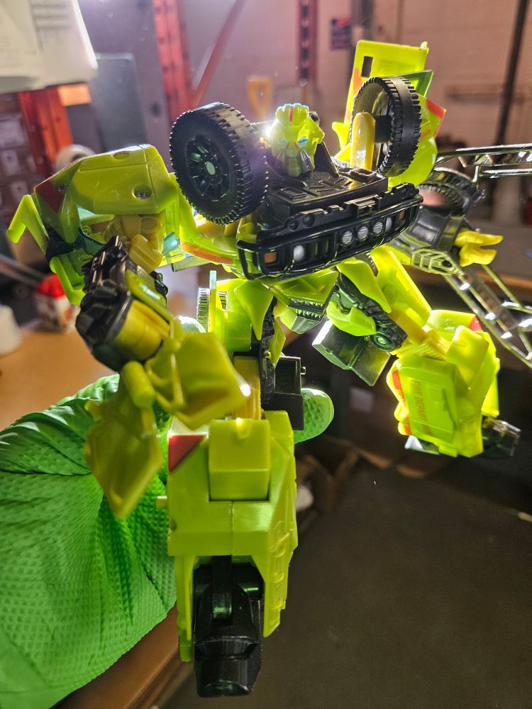 Posed with his axe deployed and grasping claw out