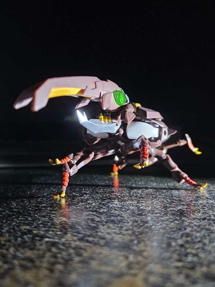 She can walk in her beetle mode.  The legs are strong enough to hold her up in bug mode