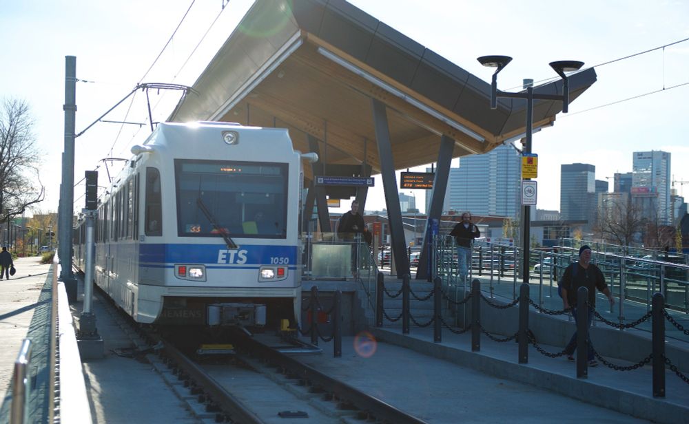 Edmonton LRT at the LRT station with people walking on the platform
