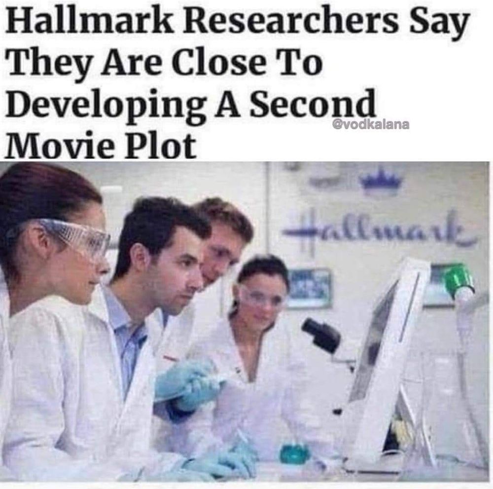 A picture of scientists in a lab looking at a screen.  The caption says, "Hallmark researches say they are close to developing a second movie plot."