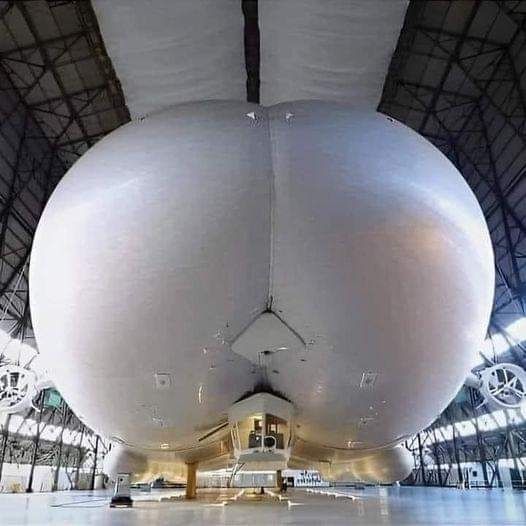 A picture of the largest aircraft in the world.  It has 2 enormous helium tanks that are prominently shown, which happens to look like a very big butt