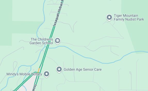 A screenshot of Google Maps near Seattle/Tacoma, WA, showing four places; Mindy's Mobile Notary, Golden Age Senior Care, the Children's Garden School, and Tiger Mountain Family Nudist Park