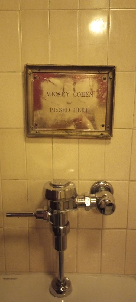Sign over a urinal at Cole's, downtown LA: "Mickey Cohen pissed here"