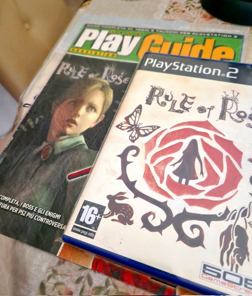 A picture of my Rule of Rose copy + my own Play Guide magazine of the game