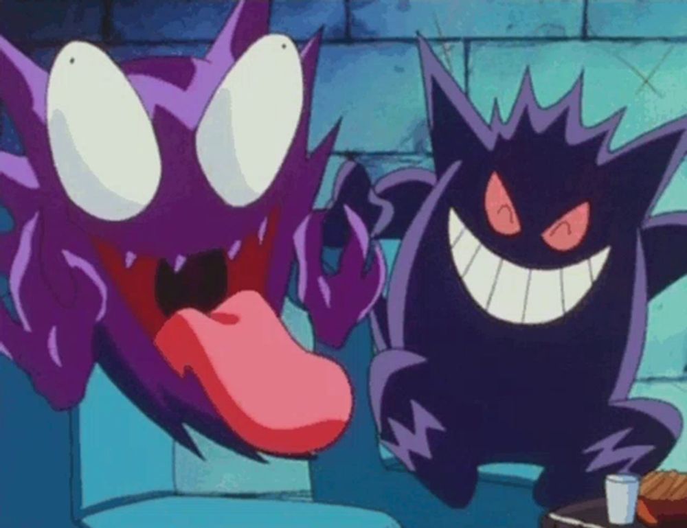 a purple cartoon character sticking its tongue out next to another cartoon character