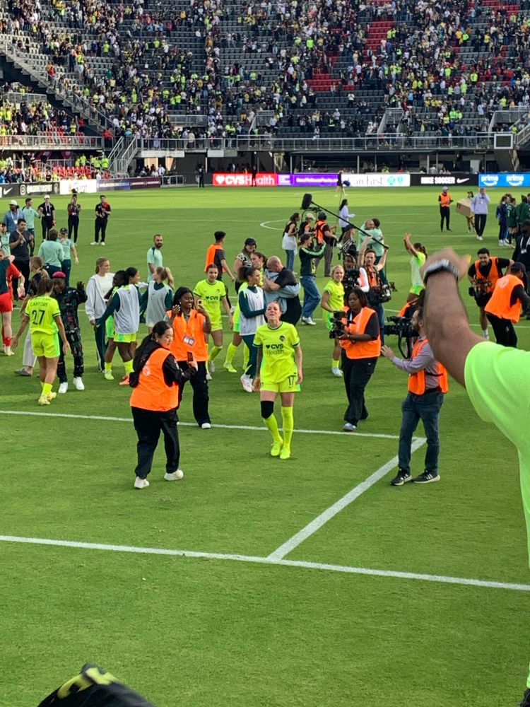 Hal Hershfelt, in a yellow kit going towards the supporters