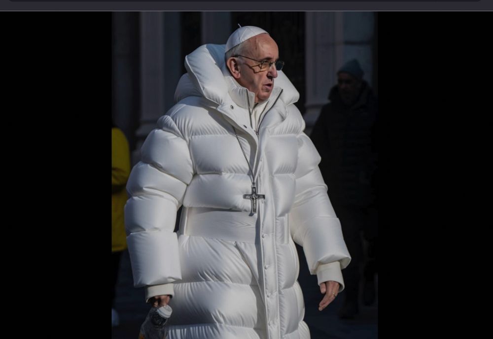 Pope Francis wearing a very stylish white puffy jacket. 