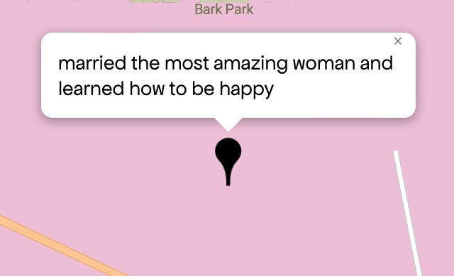 Queering The Map 
Image shows a pink map with a black pin drop on location with message that reads “married the most amazing woman and learned how to be happy“