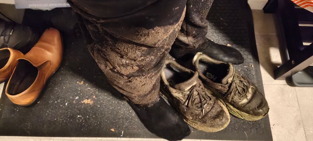 Muddy right leg and muddy shoes. Left leg can be seen behind.
