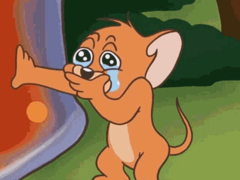 jerry from tom and jerry is crying with a tear coming out of his eye