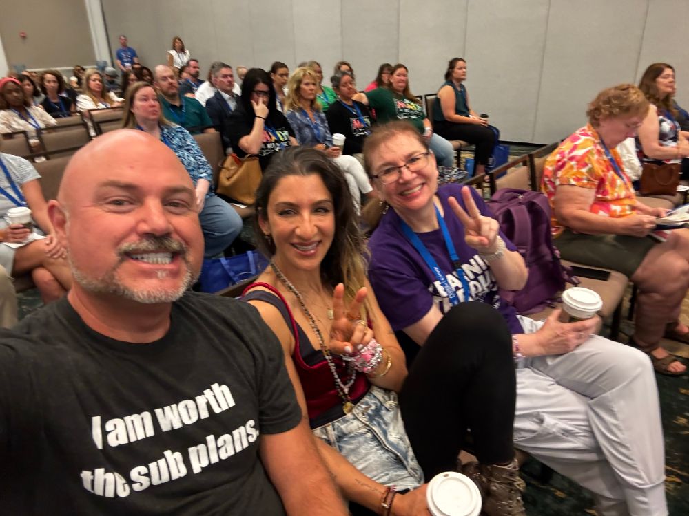 TJ, Vanessa, and Laura sitting at the FCTM opening session 
