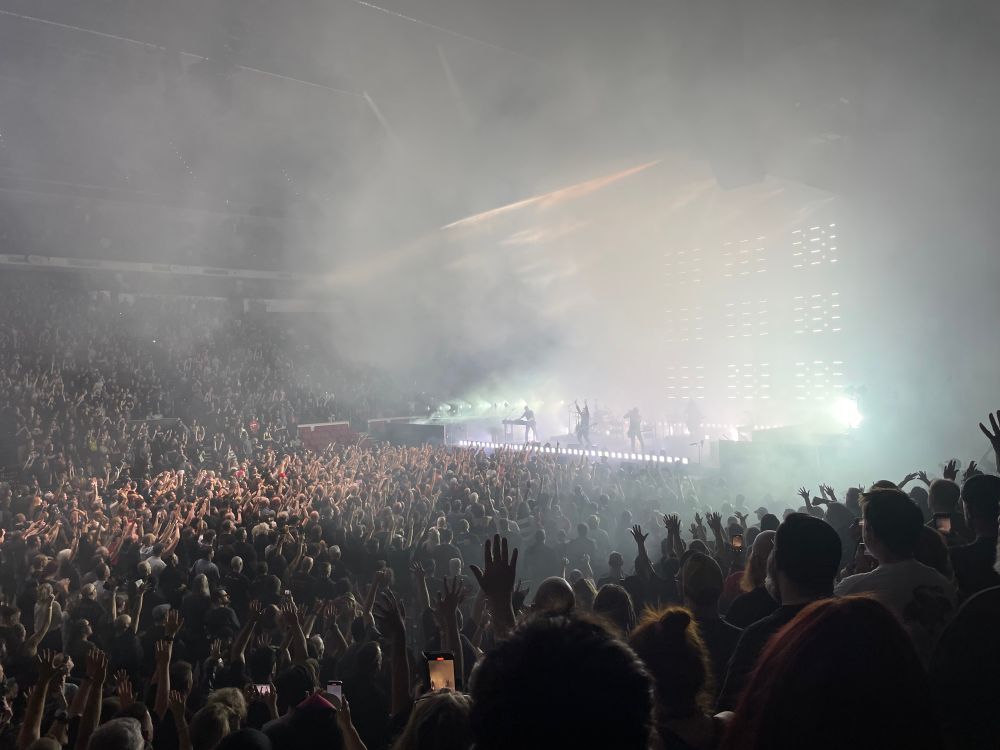 Everyone in the crowd with their hands up for Nine Inch Nails
