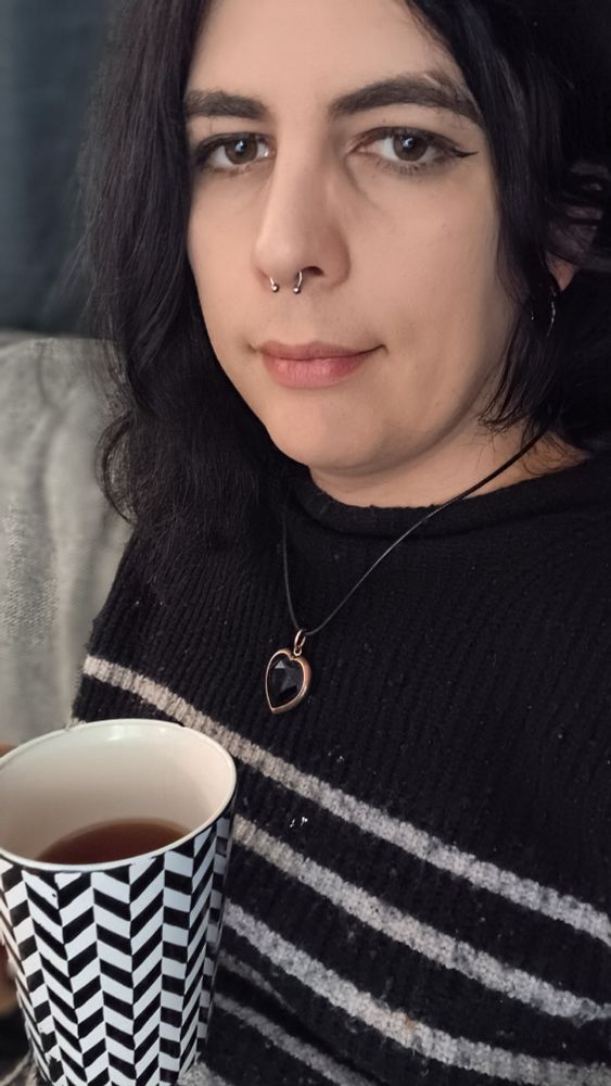Smiling girl with a hot cup of tea