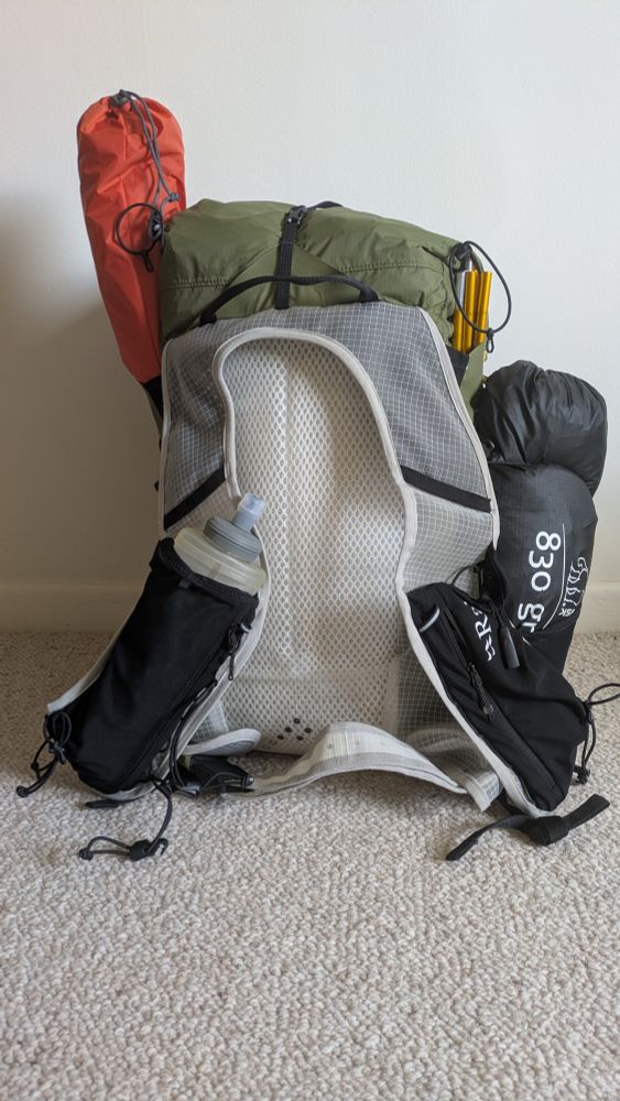 Small backpack fully loaded for a camping trip.