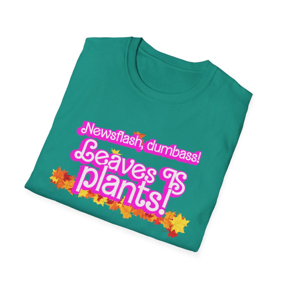 a green t-shirt with the phrase "newsflash dumbass, leaves IS plants" in a pink barbie font surrounded by autum leaves along with the URL ko-fi.com/wrassletrash/shop