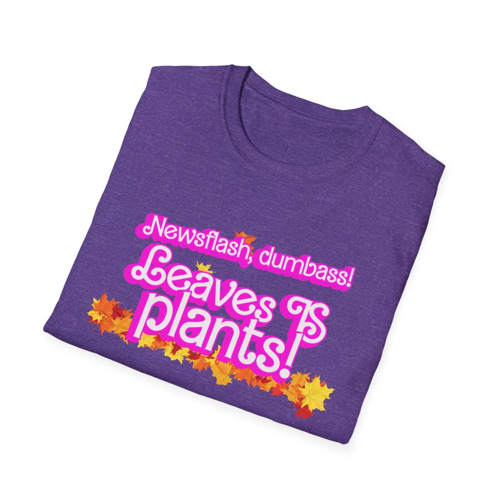 a purple t-shirt with the phrase "newsflash dumbass, leaves IS plants" in a pink barbie font surrounded by autum leaves along with the URL ko-fi.com/wrassletrash/shop