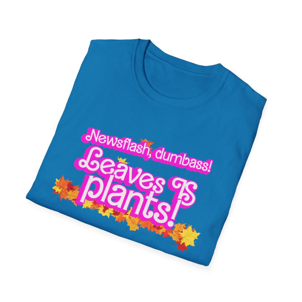 a blue t-shirt with the phrase "newsflash dumbass, leaves IS plants" in a pink barbie font surrounded by autum leaves along with the URL ko-fi.com/wrassletrash/shop
