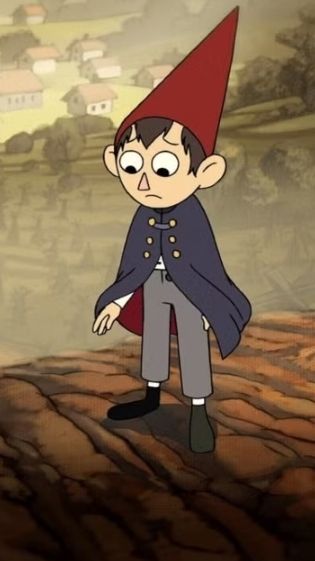wirt from over the garden wall looking sadly at the ground