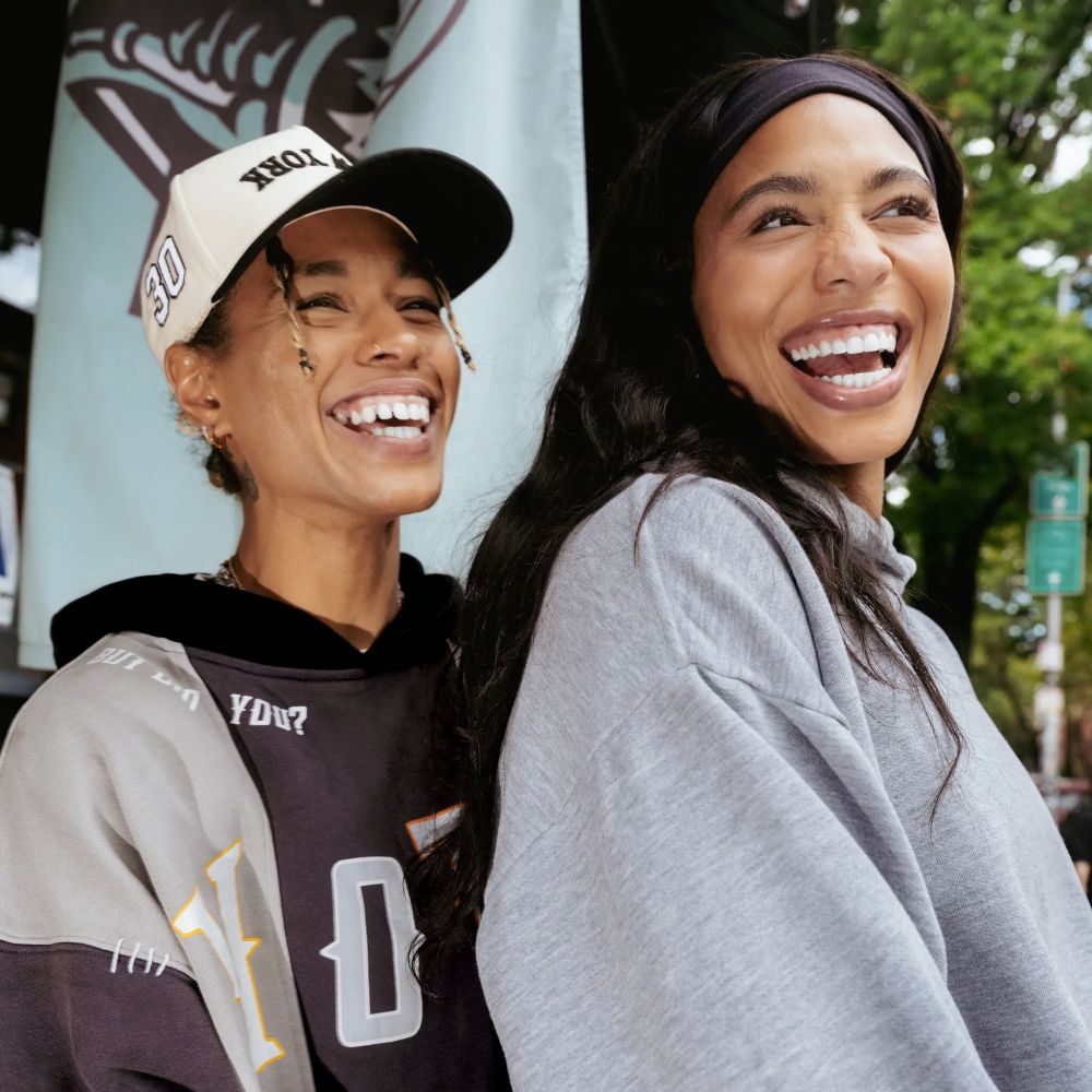 Tash and Izzy both smiling