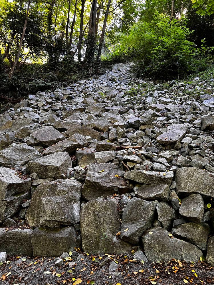 Rock pile down hill to stabilize soil. In ravine 