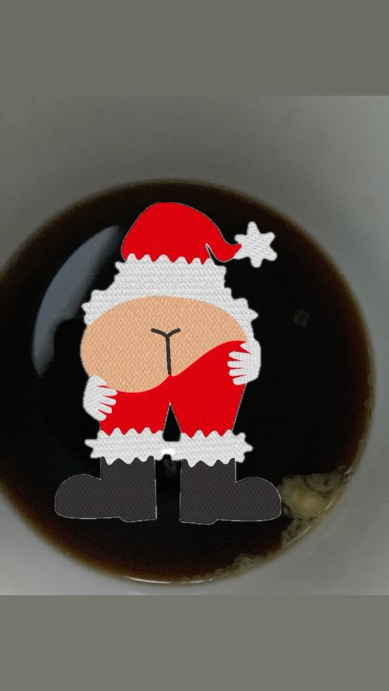Pic of Dick’s coffee cup with a cheeky picture of Santa dropping his kecks and mooning, superimposed. 