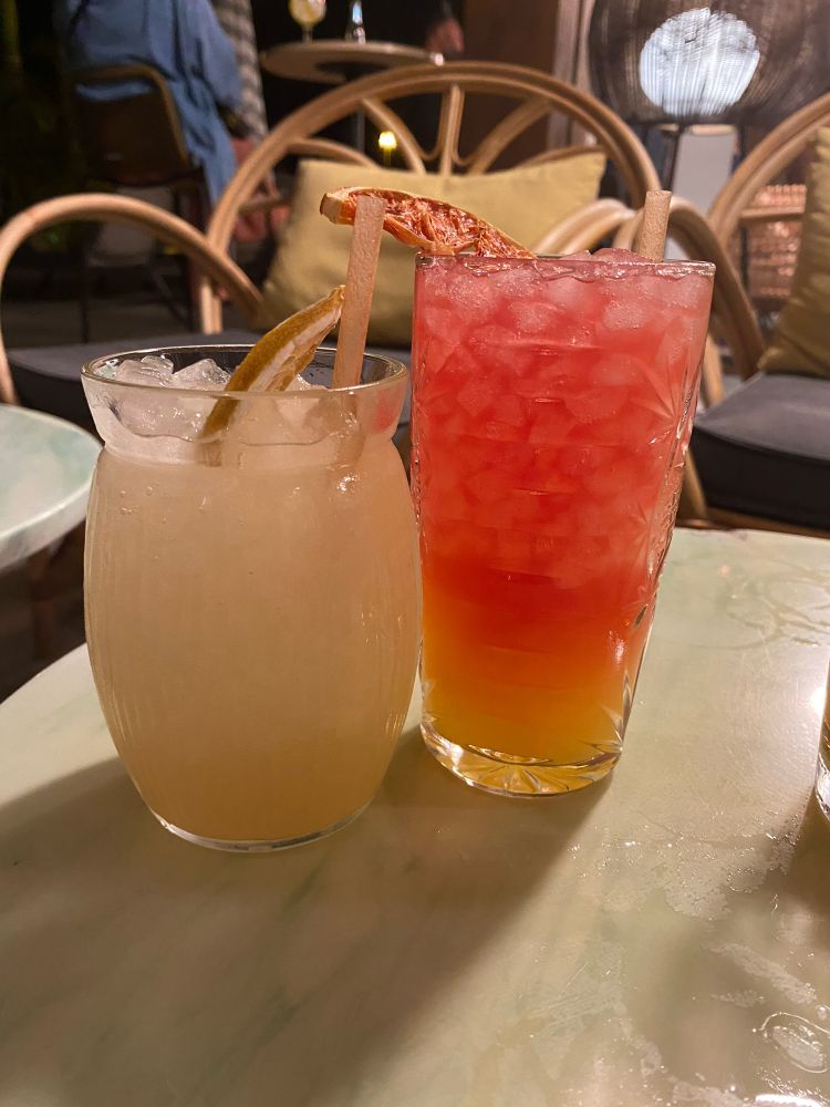 Picture of 2 cocktails, a Mai Tai in a pineapple shaped glass, and a Paloma, which contained a shit load of tequila. 