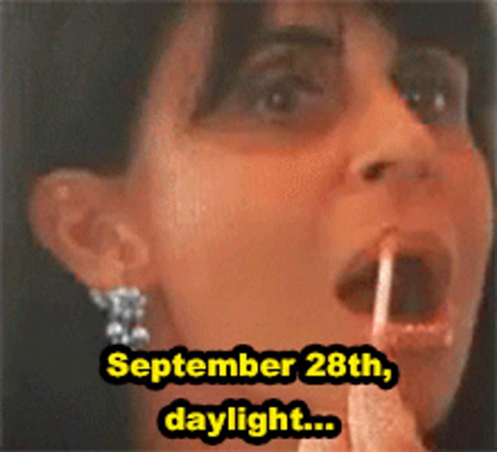 a woman is applying lip gloss and the date is september 28th