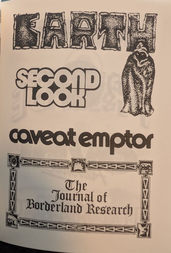 Photo of a book.
From top to bottom: 
- "EARTH" in big bold letters, a hooded figure beneath it
- "SECOND LOOK"
- "caveat emptor"
- "The Journal of Borderland Research"