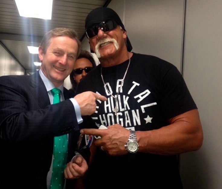 Enda Kenny meets with Hulk Hogan in an airport tunnel, 2015.