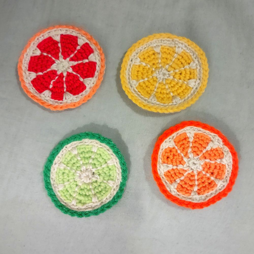 set of four citrus slice coasters: grapefruit, lemon, lime, and orange 
