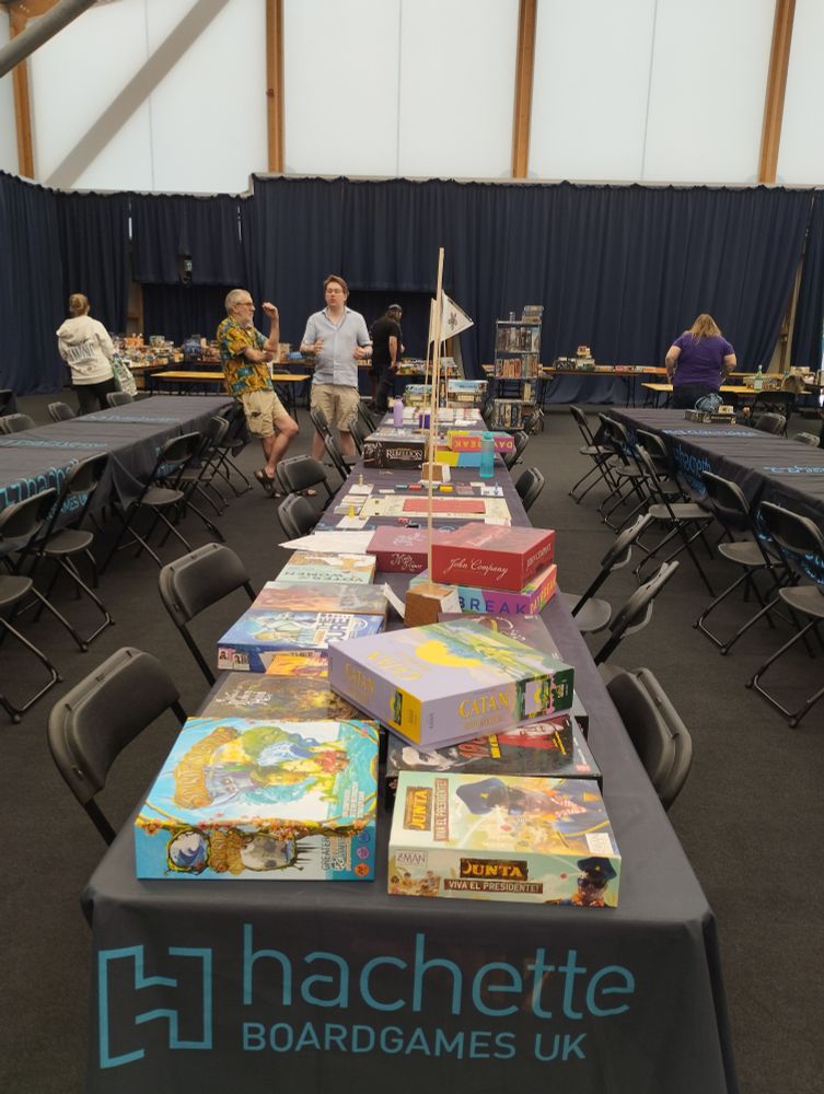 Large table laden with many board games 