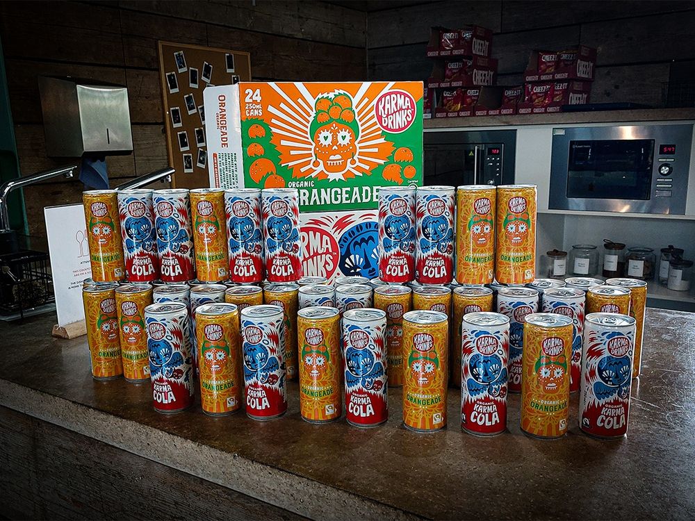 A stack of Karma Drinks, our organic sodas on offer