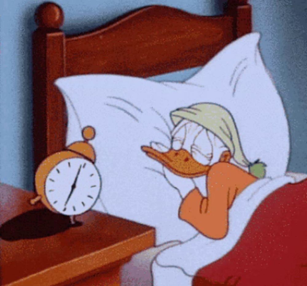 a cartoon of donald duck sleeping in a bed