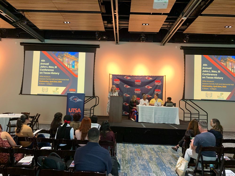 Panel of speakers at the Nau Conference on Texas History with Dr. Catherine Clinton at the podium. 