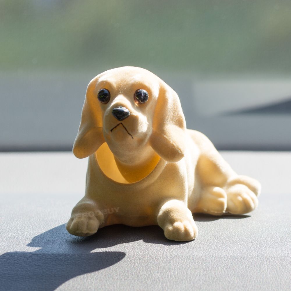Ineffectual & lame nodding dog, car ornament