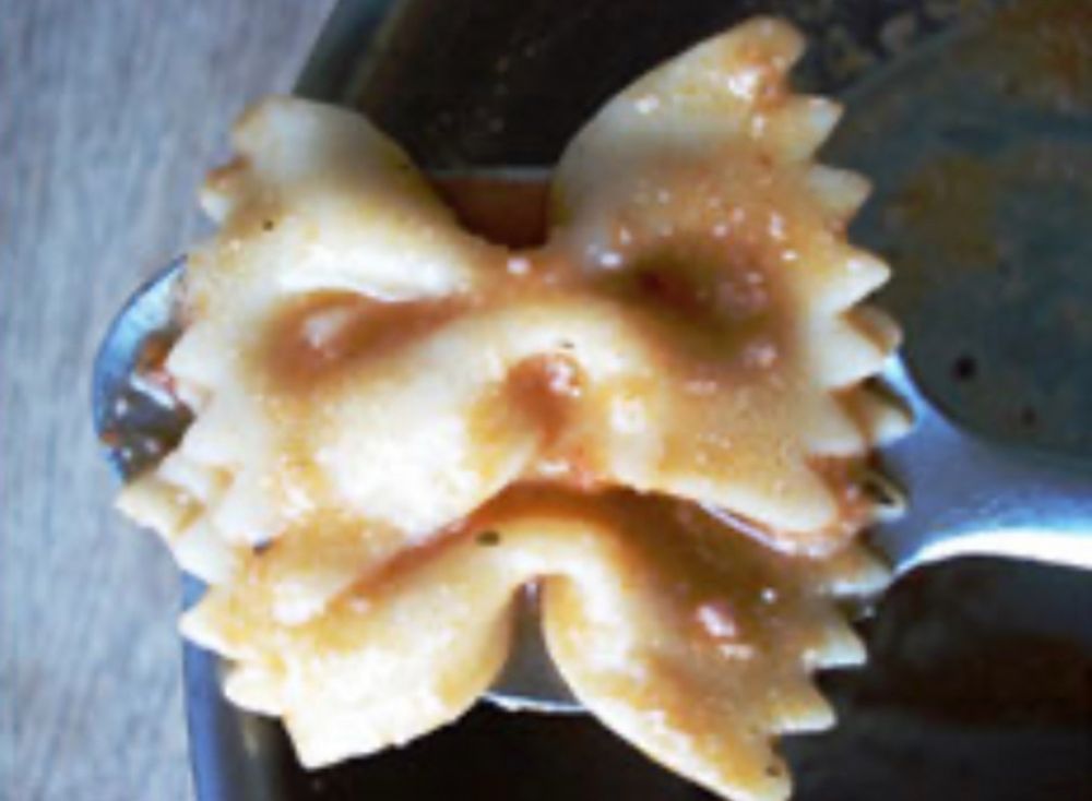 Pasta that looks like an animal face... maybe a dog.