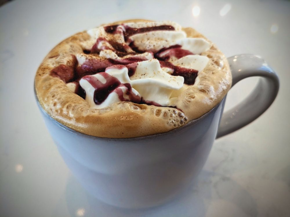A close up of a Blueberry Cobbler Latte served at The Coffee Class in Las Vegas, NV