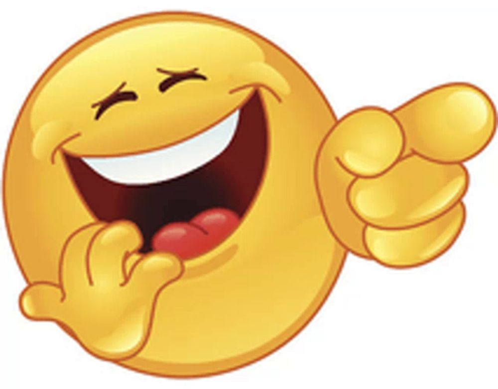 a smiley face is laughing and pointing with its eyes closed