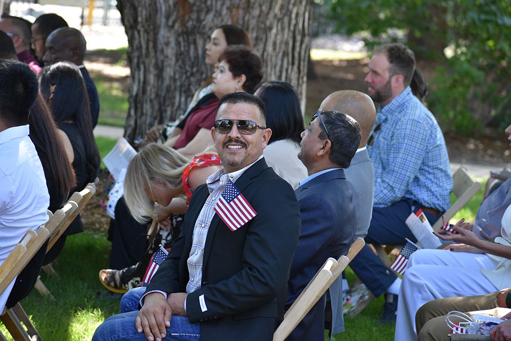 person seated at citizenship ceremony