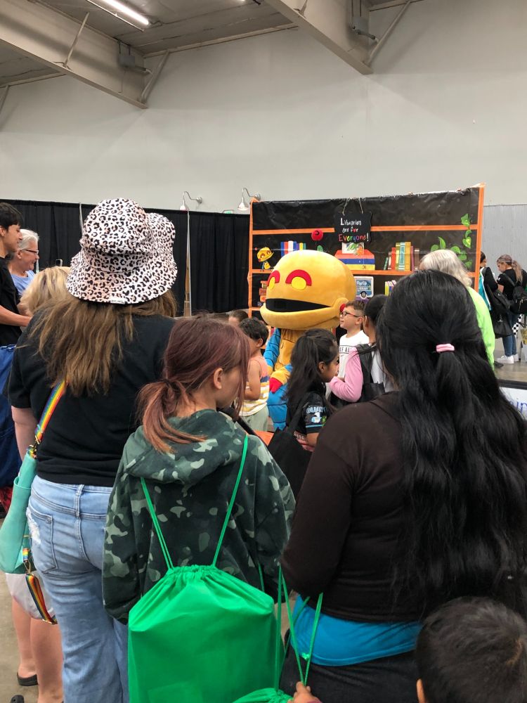 kids with yesbot mascot