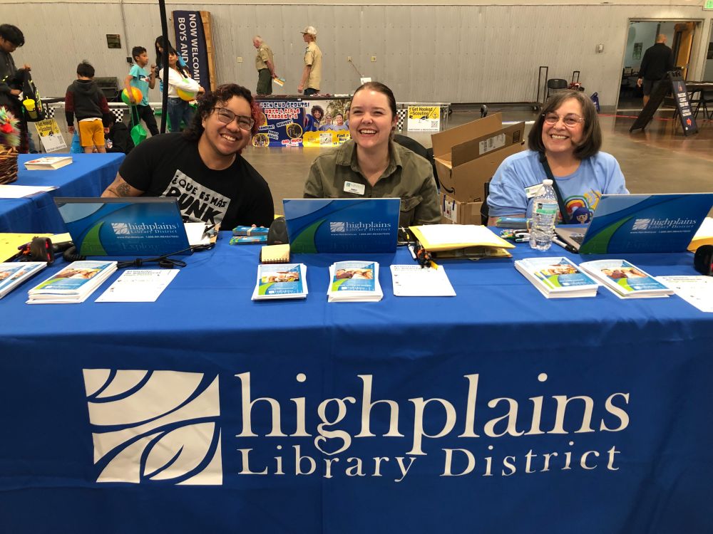 hpld staff at a table, smiling