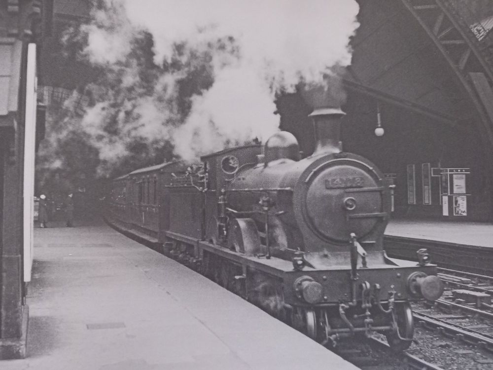 Ex-G&SWR Class 119 No. 14118 is seen departing from Glasgow St. Enoch station at the head of a passenger train bound for Largs in June 1933. 14118 was withdrawn exactly 1 year later in June 1934.

Photo Credit: LMS Steam In Scotland In The 1930s